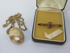 A hallmarked 9 carat gold chain approx weight 4.2g with a gold plated oval locket, together with a