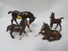 A tray of assorted Beswick, Royal Doulton horses and other foals