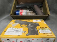 Two boxed ball bearing guns