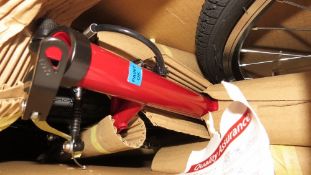 A boxed red Challenge VXT hybrid bike with steel frame, 18 speed, 28