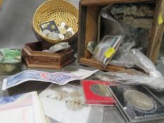 A box of assorted coins and notes
