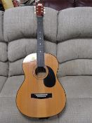 A Hohner MW300 acoustic guitar