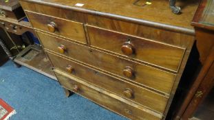 A teak five drawer chest of drawers