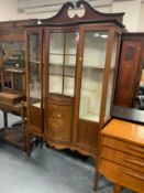 An Edwardian mahogany inlaid display cabinet