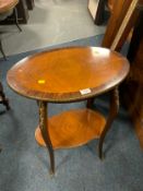 A French style two tier inlaid occasional table with gilt metal mounts