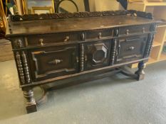 A large heavy carved oak serving sideboard W 198 cm. S/D