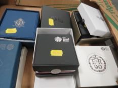 A collection of Royal Mint £5 coin collectors packs