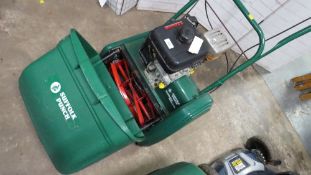 A Suffolk Punch cylinder petrol 14SK lawn mower with a Kawasaki engine