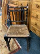 An antique bobbin wicker seat chair
