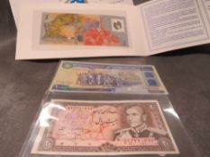 An Iran Reza Shah 20 rials and a Republic 10,000 rials together with a Kuwait 1993 liberation