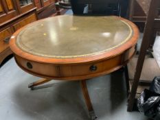 A reproduction leather topped drum type table. Dia. 104 cm