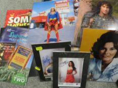 A tray of assorted collectables and ephemera to include signed photographs etc