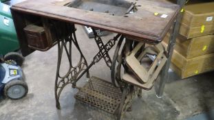 An antique cast iron American sewing machine table