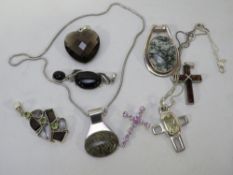 A bag of assorted silver pendants etc