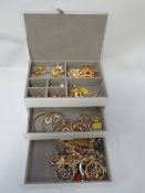 A jewellery box and contents to include earrings, rings etc