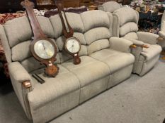 A modern three piece reclining suite