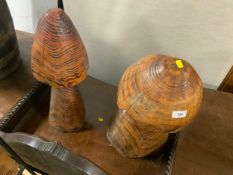 Two small wooden mushrooms