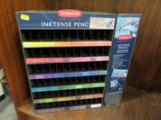 A plastic and metal sales cabinet for Derwent Inktense pencils