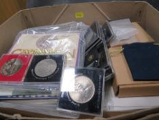 A collection of coins to include 2 x 1977 silver proof crowns in cases and various Royal Mint