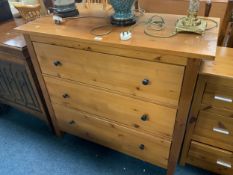 A pine three drawer chest