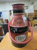 A small vintage cream churn