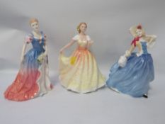 Three Royal Doulton figurines to include Autumn Breezes 1998 colourway