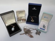 A quantity of assorted jewellery to include silver and a Swarovski pendant