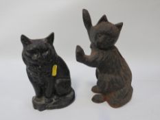 A cast metal cat doorstop