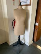 A vintage dress maker’s dummy on stand