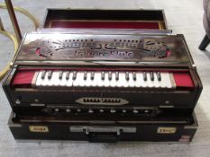 A good quality portable Indian Lahore Flute Harmonium, with 9 scale changer and 9 stops, in a fold d