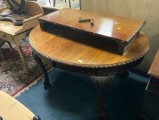 An antique mahogany wind out dining table with one extra leaf - Handle