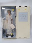 A Franklin Mint Porcelain boxed doll of 