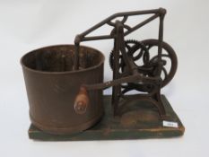 An antique mechanical food mixer