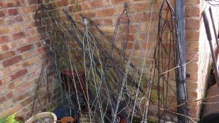 A large selection of wrought iron garden plant obelisks