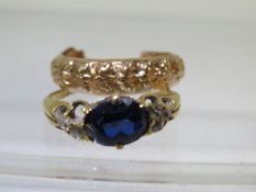 An unmarked yellow metal dress ring together with a hallmarked 9 carat gold earrings approx weight