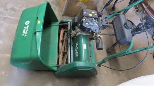 A Suffolk Punch cylinder petrol 17S lawn mower
