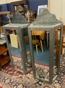 A pair of modern mirrored cabinets