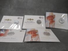 Two QEII £20 pound coins together with three other examples