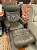 A modern reclining armchair and stool