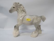 A Beswick grey cantering shire horse