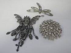 A Butler & Wilson winged skeleton brooch plus a Butler & Wilson dragonfly brooch and a decorative