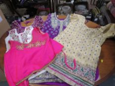 Two trays of assorted Asian clothing to include scarfs etc