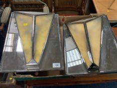 A pair of Art Deco style wall lights on mirrored panels