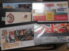 A collection of stamps to include presentation packs and autographed postal covers