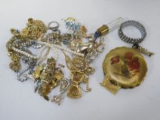 A tin of costume jewellery