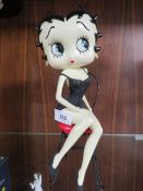 A Betty Boop sitting on a chair