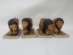 Four modern reproduction Staffordshire style lions