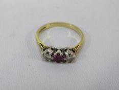 An hallmarked 18ct gold three stone ring - size N½ approx weight 3g