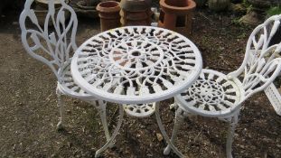A cast aluminium garden patio table and two chairs