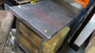 A stainless steel food preparation table